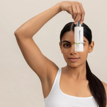 woman holding glycolic facial cleanser best for oily skin